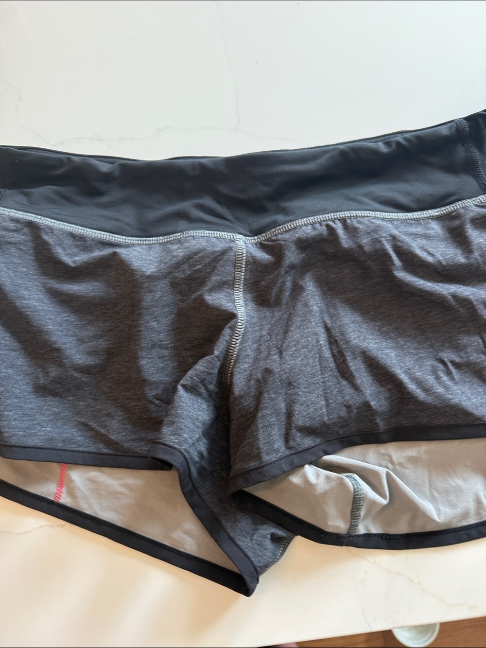 Women’s Lululemon Shorts in Dark Gray and Black liner zip pockets in back
